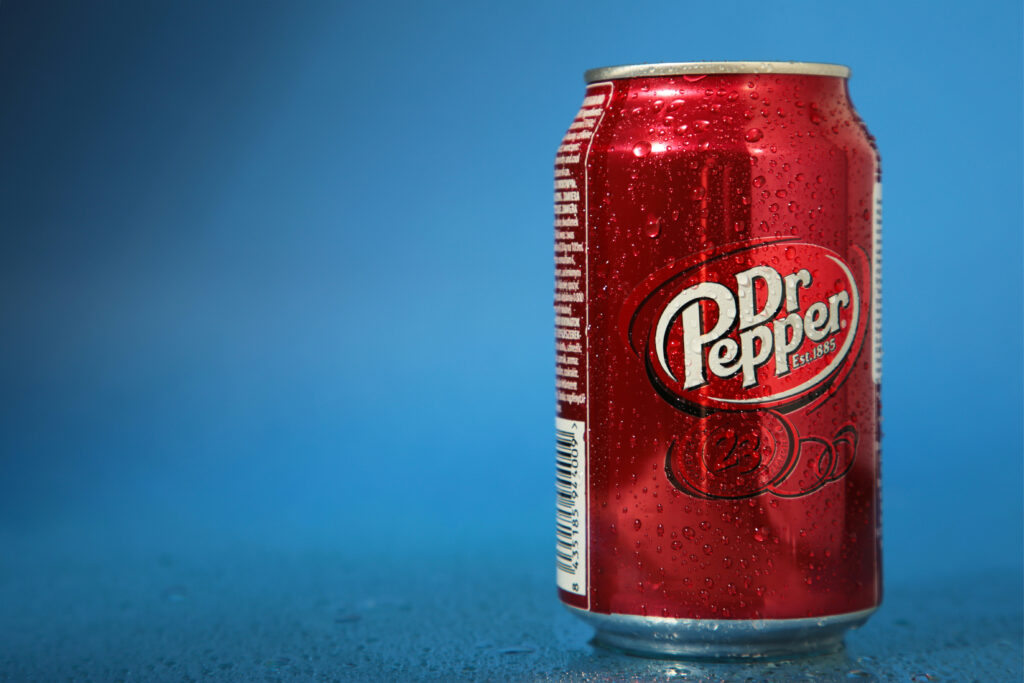 Mykolaiv Ukraine - May 2 2023 Can of Dr Pepper on blue background Space for text - Tradeinfo.cz Dr Pepper, Nestlé, JDE Peet's nápojový trh