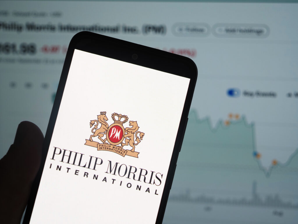 In this photo illustration Philip Morris International Inc logo is displayed on a smartphone screen - Tradeinfo.cz Philip Morris