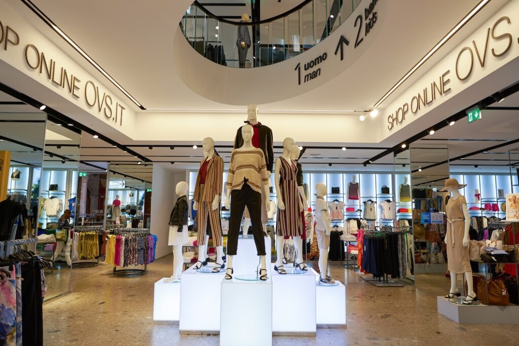 VERONA ITALY - CIRCA MAY 2019 interior shot of OVS store in Verona - Tradeinfo.cz Clothes store interior with mannequins on illuminated podiums displaying fall outfits.