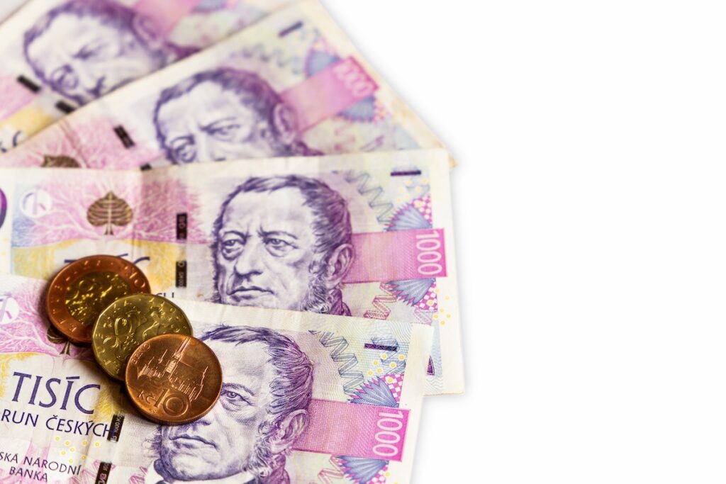 Czech money close-up on the white background - Tradeinfo.cz Inflace v Česku